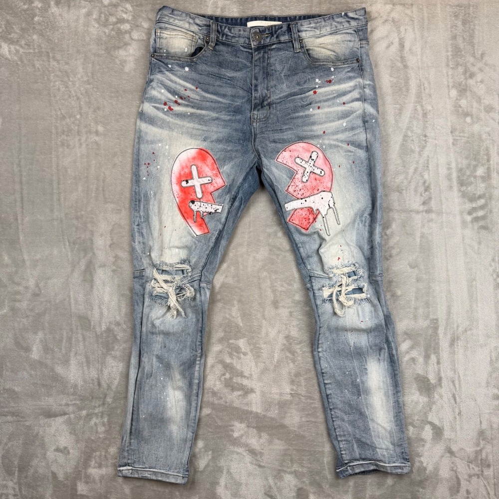 Men's Distressed Light Blue Jeans with Red Graphic Knees